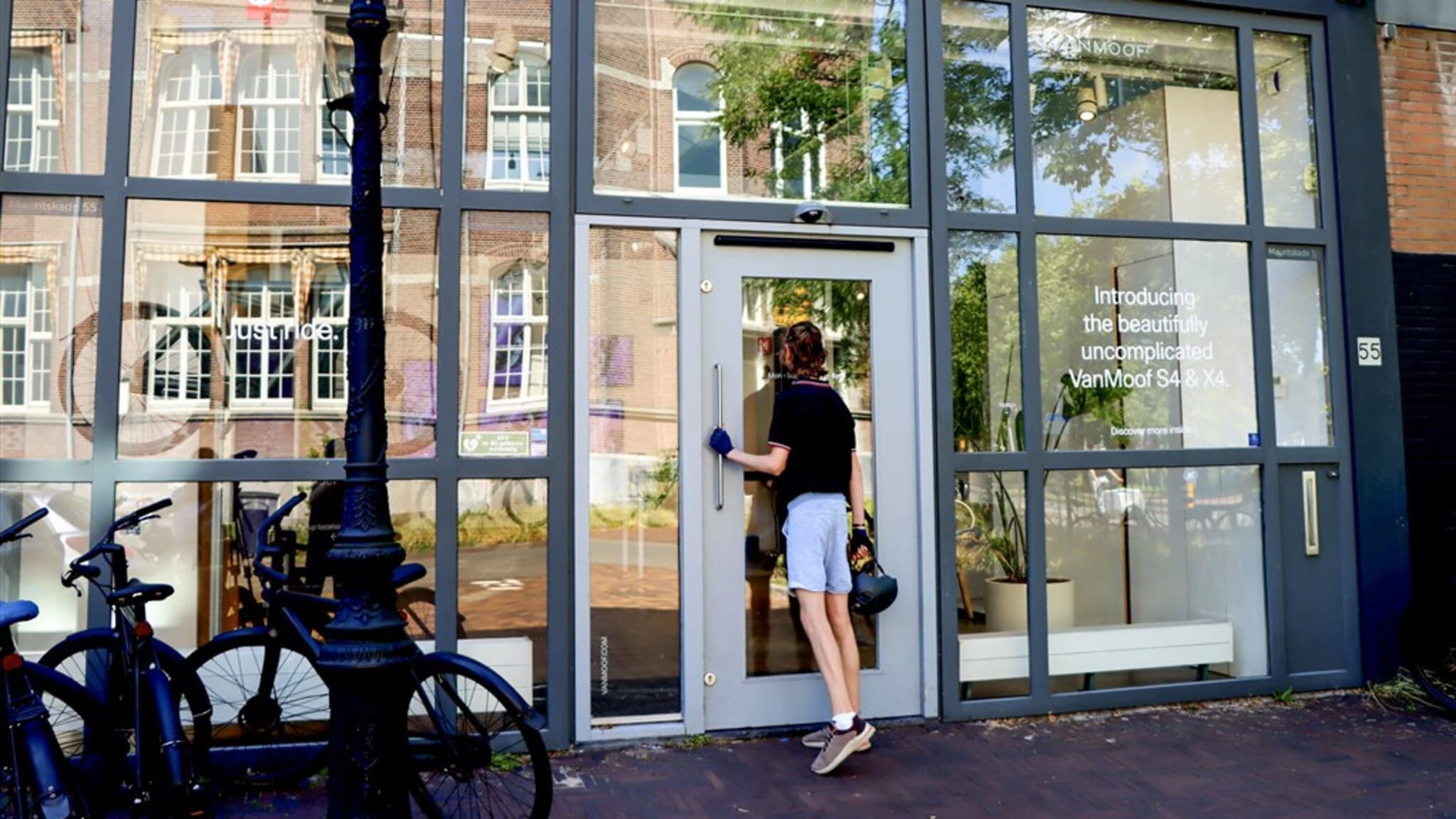 A VanMoof bicycle outside a storefront